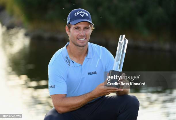 Andrea Pavan of Italy celebrates victory with the trophy on day four and final round of the the D+D REAL Czech Masters at Albatross Golf Resort on...