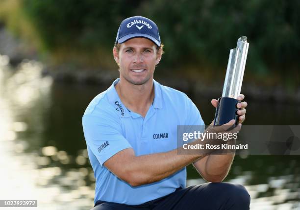 Andrea Pavan of Italy celebrates victory with the trophy on day four and final round of the the D+D REAL Czech Masters at Albatross Golf Resort on...