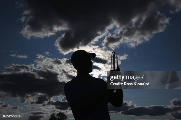 Andrea Pavan of Italy celebrates victory with the trophy on day four and final round of the the D+D REAL Czech Masters at Albatross Golf Resort on...