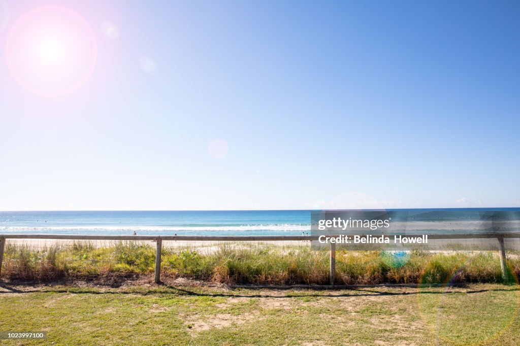 Two children playing in the sand and water on a Gold Coast Beach, Queensland  Australia