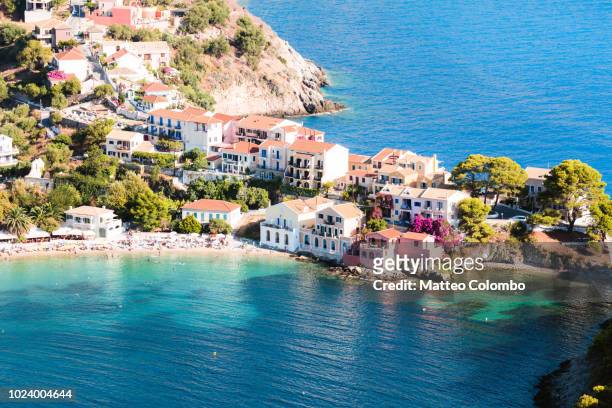 town of assos with colorful houses on the mediterranean sea, greece - kefalonia fotografías e imágenes de stock