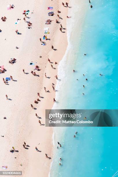 aerial view of beach in summer with people. zakynthos, greek islands, greece - crowd from above stock-fotos und bilder