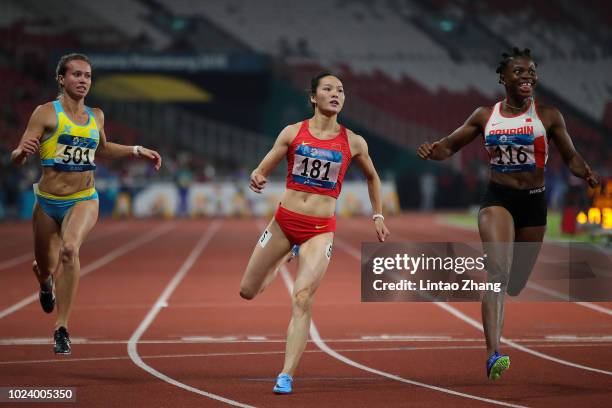 Kazakhstan's Olga Safronova, China's Wei Yongli and Bahrain's Edidiong Odiong compete in the final of the women's 100m athletics event on day eight...