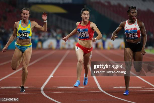 Kazakhstan's Olga Safronova, China's Wei Yongli and Bahrain's Edidiong Odiong compete in the final of the women's 100m athletics event on day eight...