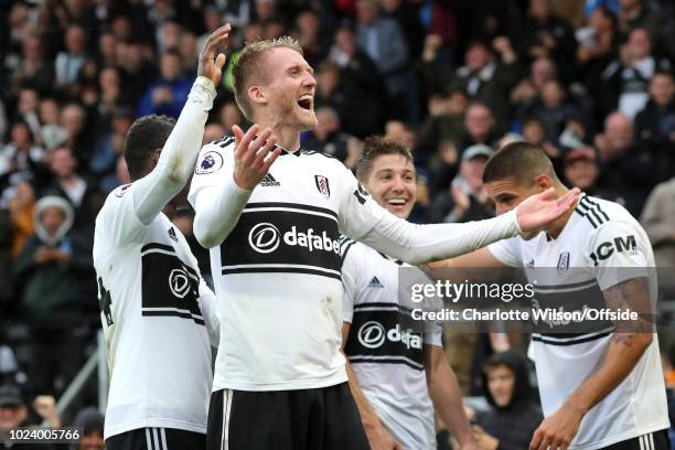 Andre Schurrle of Fulham celebrates scoring their 4th goal during the Premier League match between Fulham FC and Burnley FC at Craven Cottage on...