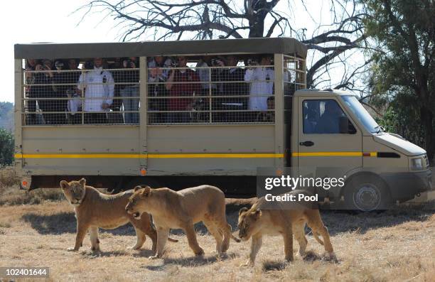 Players of the German National Team drive with a van during a visit of the Lion Park on June 25, 2010 in Lanseria, South Africa.