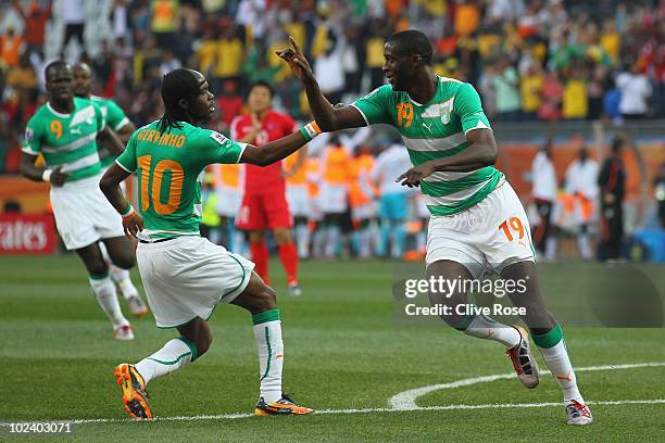 Yaya Toure of the Ivory Coast celebrates scoring the opening goal with team mate Gervinho during the 2010 FIFA World Cup South Africa Group G match...
