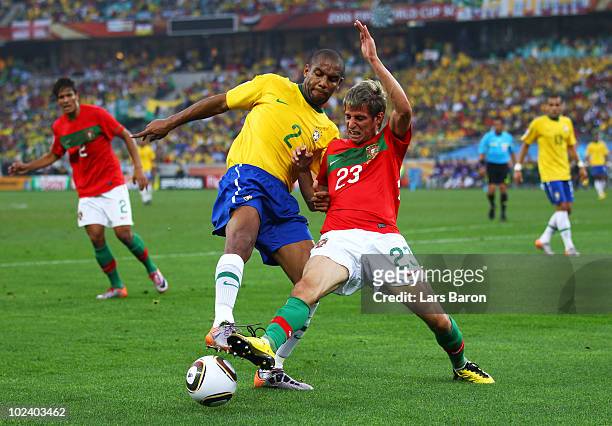 Fabio Coentrao of Portugal and Maicon of Brazil battle for the ball during the 2010 FIFA World Cup South Africa Group G match between Portugal and...