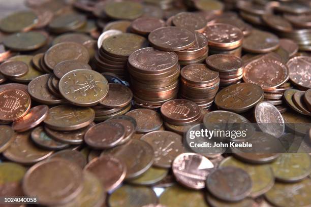 General view of one and two pence copper coins on August 23, 2018 in London, England. A Bank of England report has suggested that a withdrawal of...