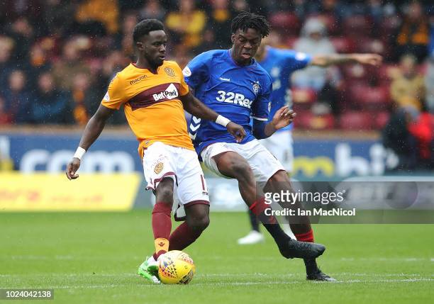 Gaël Bigirimana of Motherwell vies with Ovie Ejaria of Rangers during the Scottish Premier League match between Motherwell and Rangers at Fir Park on...