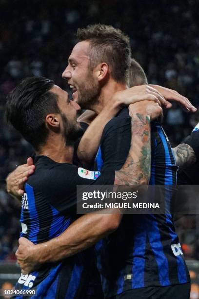 Inter Milan's Dutch defender Stefan de Vrij celebrates with Inter Milan's Italian midfielder Matteo Politano after scoring during the Italian Serie A...