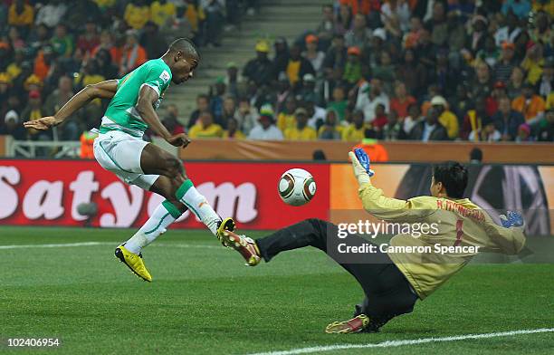 Salomon Kalou of the Ivory Coast scores his side's third goal past Ri Myong-Guk of North Korea during the 2010 FIFA World Cup South Africa Group G...