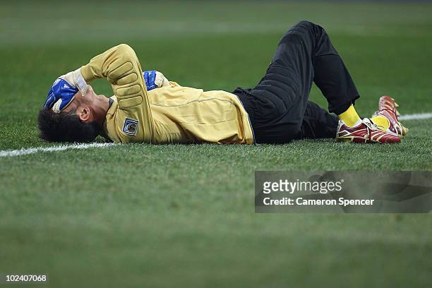 Ri Myong-Guk of North Korea lies injured on the pitch during the 2010 FIFA World Cup South Africa Group G match between North Korea and Ivory Coast...