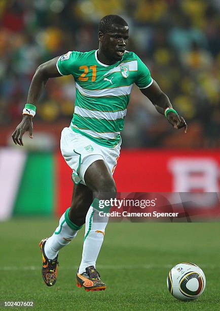 Emmanuel Eboue of the Ivory Coast runs with the ball during the 2010 FIFA World Cup South Africa Group G match between North Korea and Ivory Coast at...