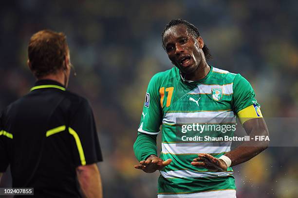 Didier Drogba of Ivory Coast talks with the linesman during the 2010 FIFA World Cup South Africa Group G match between North Korea and Ivory Coast at...