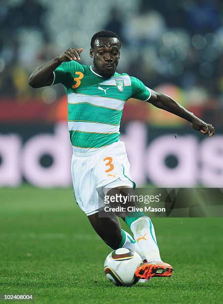 Arthur Boka of the Ivory Coast runs with the ball during the 2010 FIFA World Cup South Africa Group G match between North Korea and Ivory Coast at...