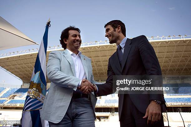 Sheikh Abdallah Ben Nasser Al-Thani , a member of the Qatari ruling family, shakes hands with the President of Malaga football club Fernando Sanz...