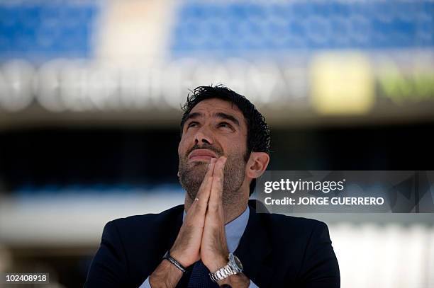 The President of Malaga's football club Fernando Sanz gestures during the presentation ofSheikh Abdallah Ben Nasser Al-Thani, a member of the Qatari...