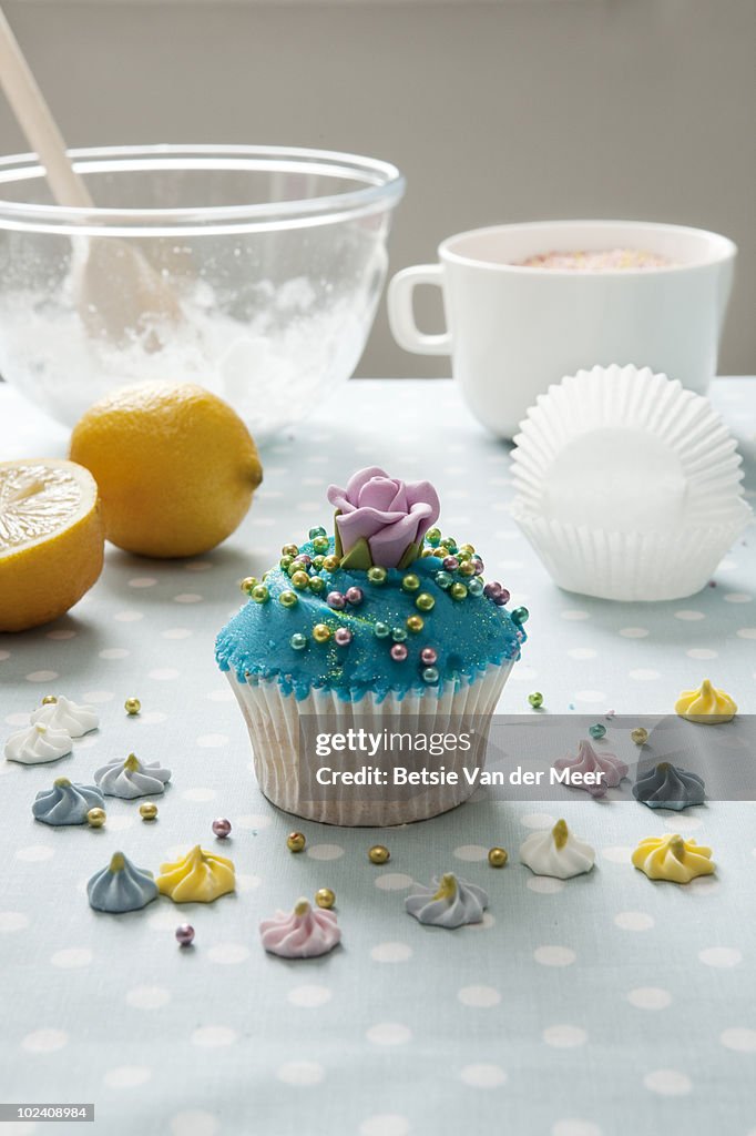 Stilllife of cake baking with finished cupcake.