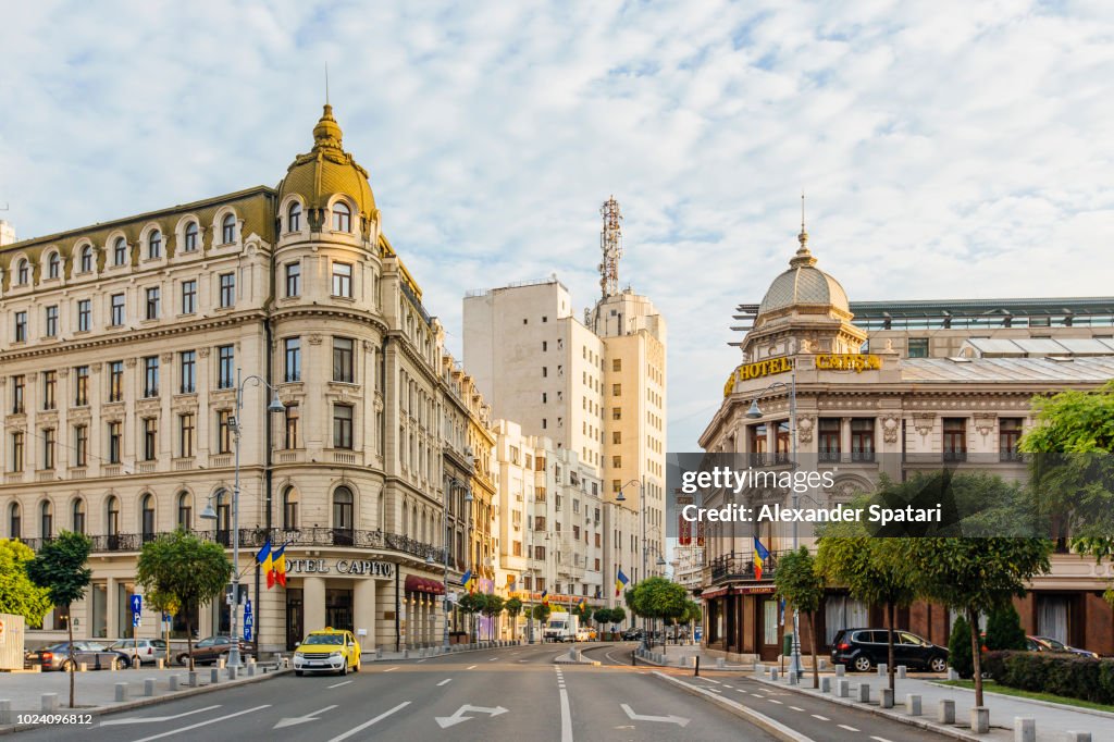 Bucharest street with historic buildings early in the morning, Bucharest, Romania