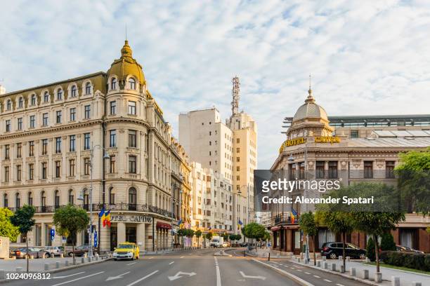 bucharest street with historic buildings early in the morning, bucharest, romania - bucharest stock pictures, royalty-free photos & images
