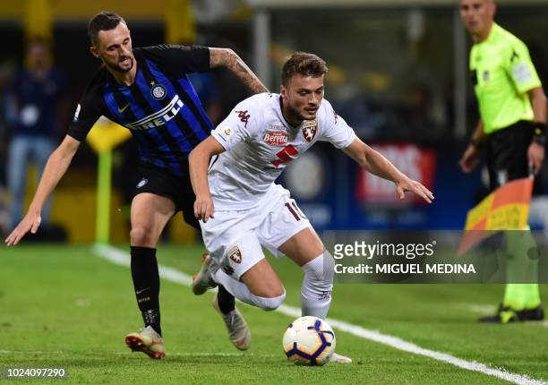 Torino's Serbian forward Adem Ljajic outruns Inter Milan's Croatian midfielder Marcelo Brozovic during the Italian Serie A football match Inter Milan...