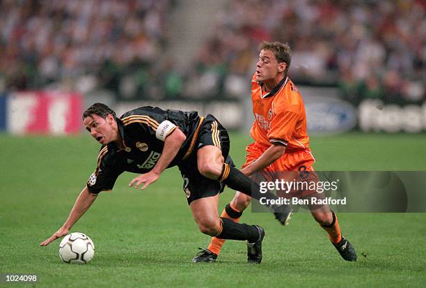 Fernando Redondo of Real Madrid is fouled by Farinos of Valencia during the European Champions League Final 2000 at the Stade de France, Saint-Denis,...