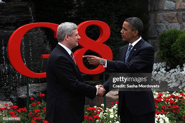 Canadian Prime Minister Stephen Harper greets U.S. President Barack Obama during a welcoming ceremony at the G-8 summit at the Deerhurst Resort at...