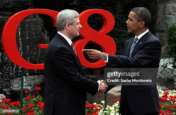 Canadian Prime Minister Stephen Harper greets U.S. President Barack Obama during a welcoming ceremony at the G-8 summit at the Deerhurst Resort at...