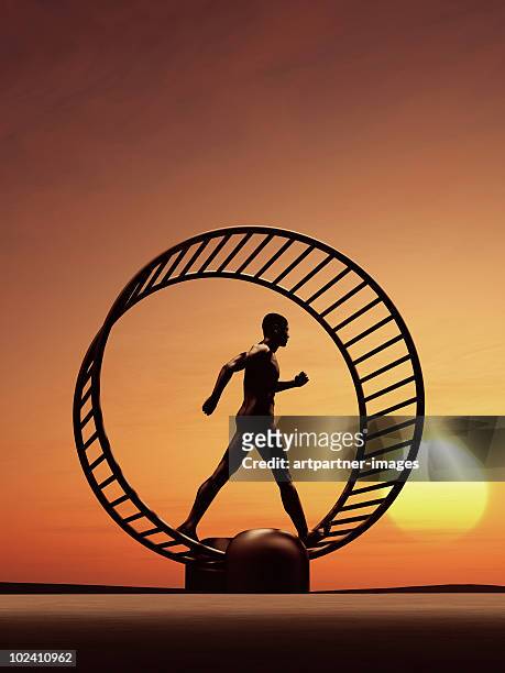 man running in a hamster wheel  - regular guy stock pictures, royalty-free photos & images