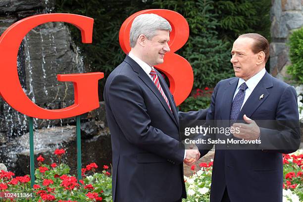 Canadian Prime Minister Stephen Harper greets Italian Prime Minister Silvio Berlusconi during a welcoming ceremony at the G-8 summit at the Deerhurst...