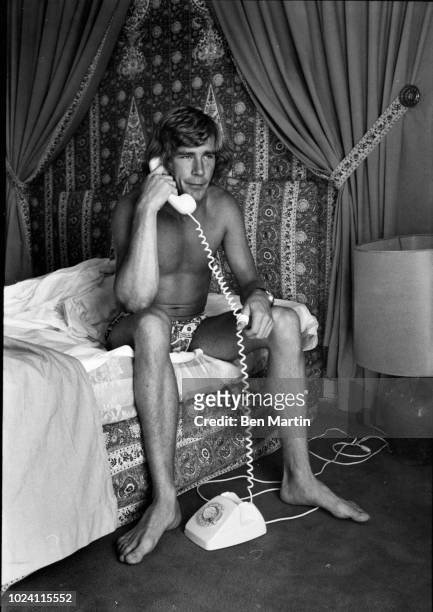 James Hunt , 29 year-old British racing driver at home on the telephone, UK, 6th September 1977.