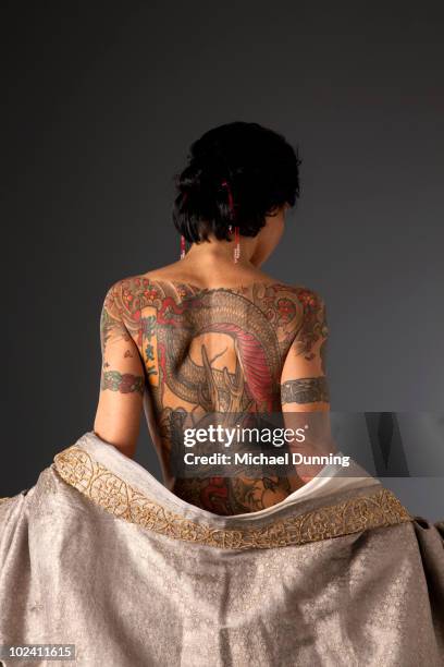 dragon tattoo lady - back tattoo stock pictures, royalty-free photos & images