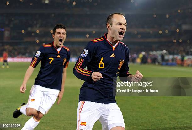 Andres Iniesta of Spain celebrates scoring the second goal for his team with David Villa during the 2010 FIFA World Cup South Africa Group H match...