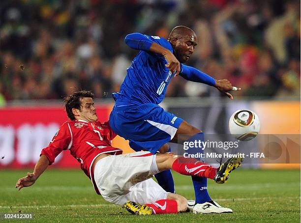 Julio Cesar de Leon of Honduras is tackled by Tranquillo Barnetta of Switzerland during the 2010 FIFA World Cup South Africa Group H match between...