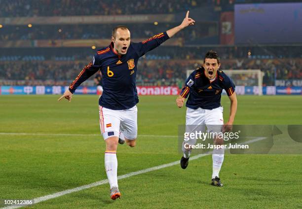 Andres Iniesta of Spain celebrates scoring the second goal for his team with David Villa during the 2010 FIFA World Cup South Africa Group H match...