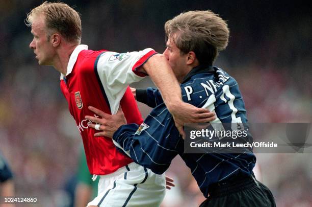 August 1999 - Premiership Football - Arsenal v Manchester United - Dennis Bergkamp of Arsenal and Phil Neville of Manchester United -