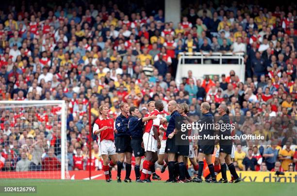 August 1999 - Premiership Football - Arsenal v Manchester United - Patrick Vieira of Arsenal and Jaap Stam of Manchester United are held back by...