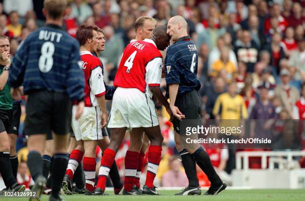 August 1999 - Premiership Football - Arsenal v Manchester United - Patrick Vieira of Arsenal and Jaap Stam of Manchester United clash heads as they...