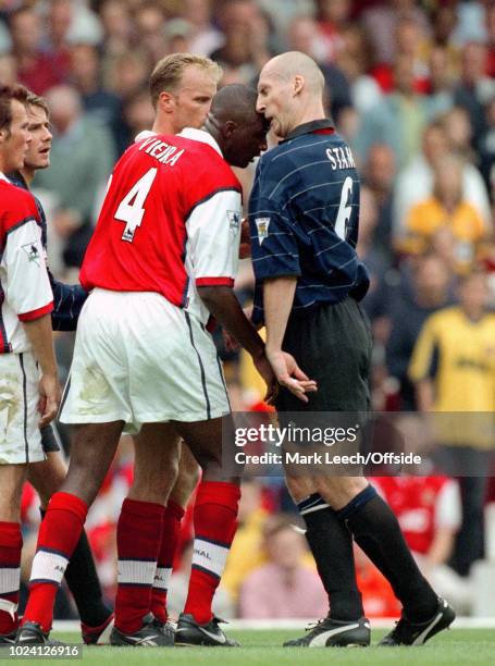 August 1999 - Premiership Football - Arsenal v Manchester United - Patrick Vieira of Arsenal and Jaap Stam of Manchester United clash heads as they...