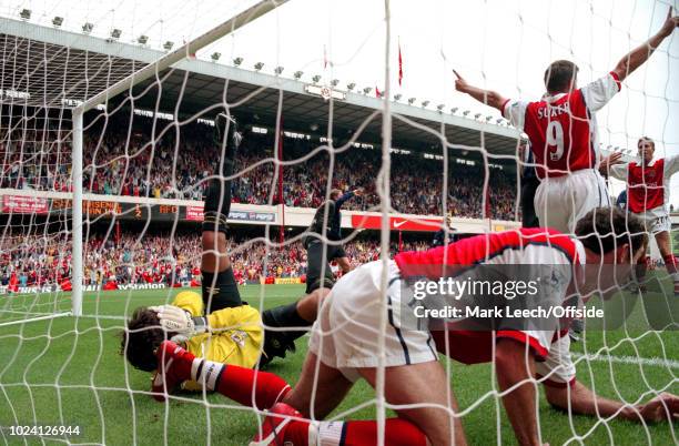 August 1999 - Premiership Football - Arsenal v Manchester United - Manchester United goalkeeper Raimond van der Gouw clutches his face in pain after...