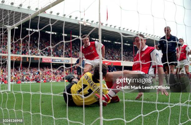 August 1999 - Premiership Football - Arsenal v Manchester United - Martin Keown of Arsenal, watched by Roy Keane of Manchester United and Davor Suker...