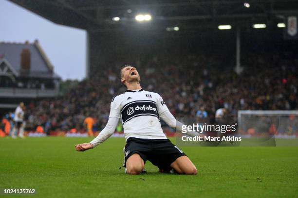 Andre Schurrle of Fulham celebrates scoring their 4th goal during the Premier League match between Fulham FC and Burnley FC at Craven Cottage on...