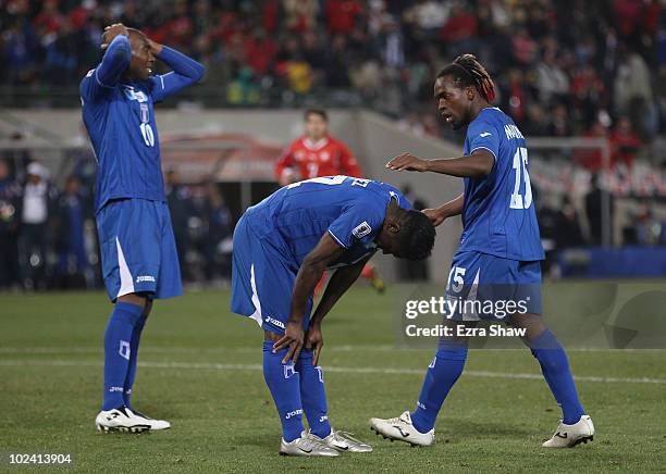 Edgar Alvarez of Honduras reacts as team mates Jerry Palacios and Walter Martinez of Honduras look on during the 2010 FIFA World Cup South Africa...