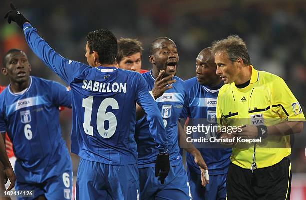 Osman Chavez of Honduras speaks to referee Hector Baldassi during the 2010 FIFA World Cup South Africa Group H match between Switzerland and Honduras...