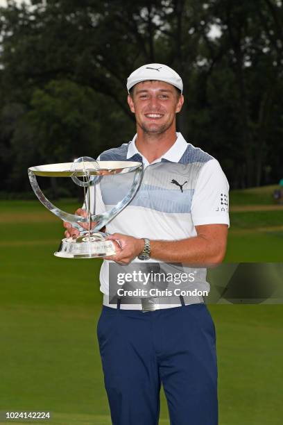 Bryson DeChambeau poses with the tournament trophy after winning THE NORTHERN TRUST at Ridgewood Country Club on August 26, 2018 in Paramus, New...