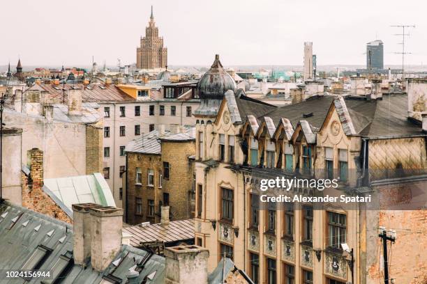 art nouveau buildings and soviet building in the background in riga, latvia - riga stock pictures, royalty-free photos & images