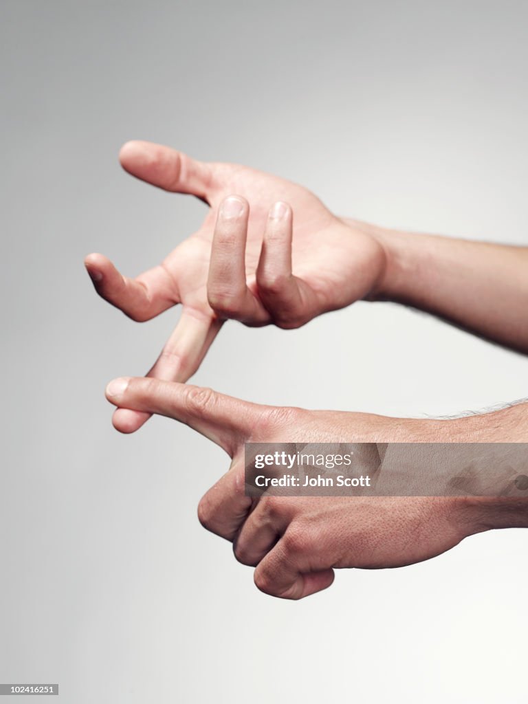 Man counting on fingers, close-up of hands