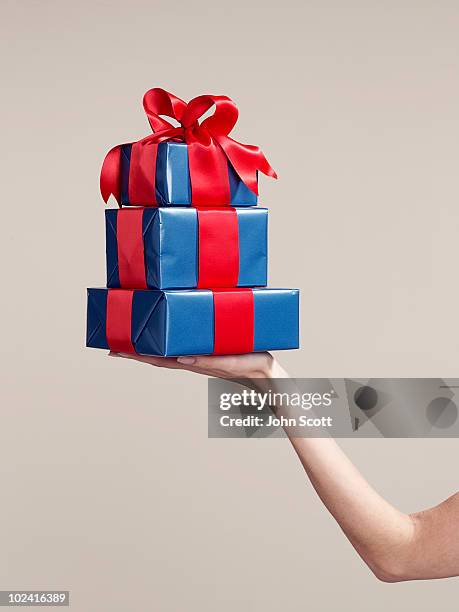woman holding stack of gifts - present box imagens e fotografias de stock