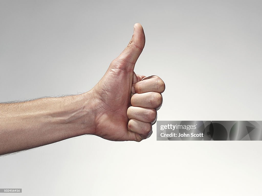 Hand giving the thumbs up